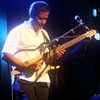 Susmit Sen in his natural state - lips pursed for focus, guitar in hand.